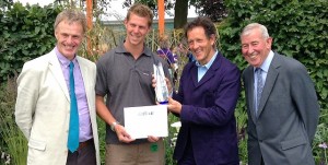 Richard Ayles from Slate Grey is pictured receiving the award from Monty Don and the show judges Tim Miles and Jim Buttress