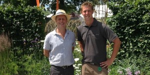 Slate Grey director Richard Ayles poses for a photo in his winning show garden with Joe Swift