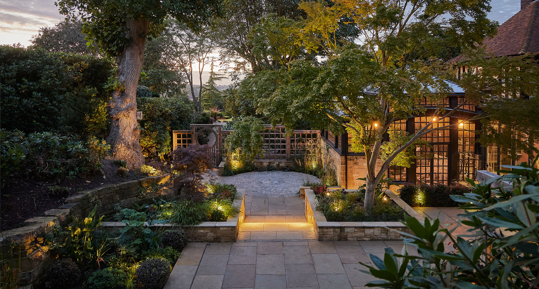 country garden patio and planting harmonious with the landscape
